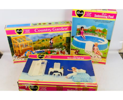 Pedigree - 3 boxed Sindy items. Includes #44389 Country Garden, #44388 Swimming Pool and #44585 Bedroom Gift Set. Item show s