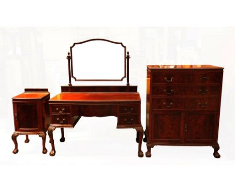 An early 20th century mahogany Chippendale style three-piece bedroom suite comprising tallboy, dressing table and pot cupboar