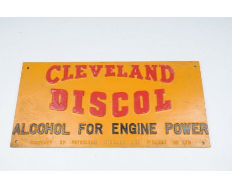 A Cleveland Discol petrol advertising garage wall plaque 
The rectangular form yellow painted plaque with red and black text 