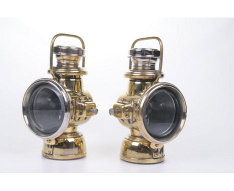 A pair of early 20th Century Powell & Hanmer of Birmingham brass car lamps 
The stepped brass base with barrel fitting and 4 