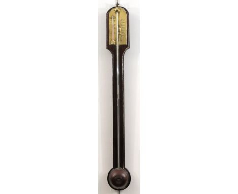 An early 20th Century mahogany stick barometer 
The arched top extending to an applied gauge brass plate with thermometer wit