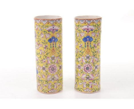 A pair of Chinese lemon yellow sleeve vases, late Qing Dynasty (1644-1912)
Each of typical cylindrical form, the lemon yellow