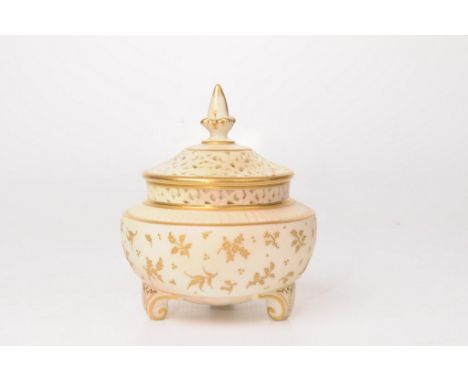 A Royal Worcester Works reticulated pot-pourri lidded vase, early 20th Century
The bombe shaped blue ivory vase, detailed wit