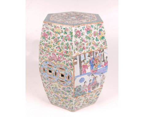 A Chinese famille rose garden seat, late 19th Century 
The hexagonal shaped seat of rounded form, applied with gilded rounded