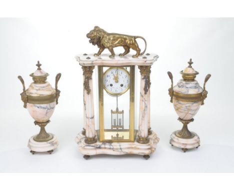 A late 19th Century French ormulu and marble clock garniture
The architectural mantle clock with Corinthian columns extending