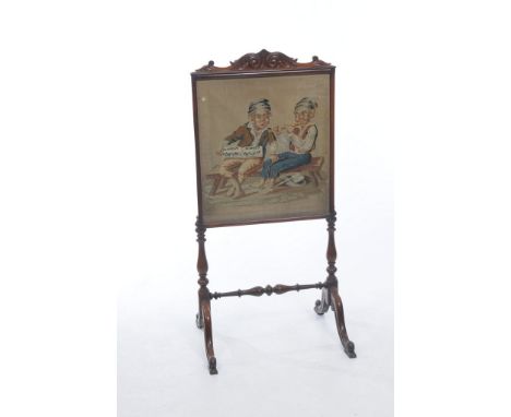 A Victorian rosewood needlework screen
With a leafy scroll crest above a glazed panel depicting two figures playing a flute, 