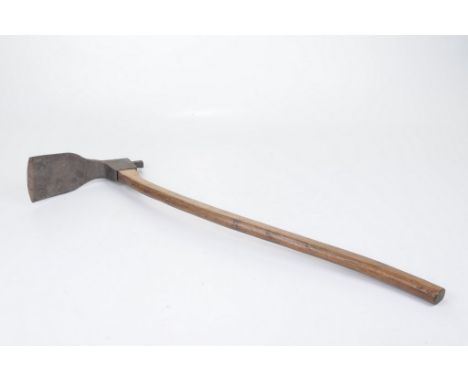 A vintage adze 
The carved elm handle, supporting a cast metal square shaped blade with button terminal, no makers mark, 73cm