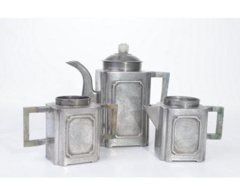 A Fan Luzeng type pewter and faux jade three-piece tea service
Comprising a tea pot, milk jug and sucrier, each of square sec