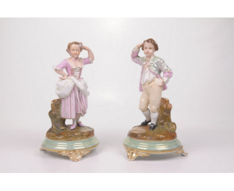 A pair of late 19th Century Paris Porcelain figures
Each modelled as mirror image of male and female figures, dressed in elab