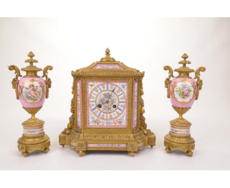 A fine quality French late 19th Century Sevres and Ormulu clock garniture
The central clock cast in an architectural form wit