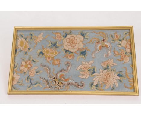 A Chinese silkwork embroidered panel, Circa 1900
The rectangular form pale blue ground panel, embroidered in ivory and gilt t