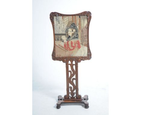 A Victorian rosewood firescreen
The rectangular glazed needlework  banner depicting a young woman kneeling at an altar , with