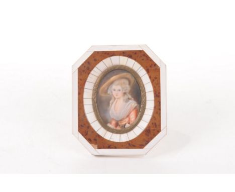 A 19th Century ivory portrait miniature
The oval miniature painted with depiction of Miss Bingham, dressed in wide brimmed ha