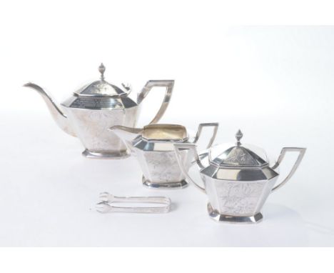 A Chinese early 20th Century export Tackhing of Hong Kong three piece silver tea service
Comprising teapot, lidded sucrier an