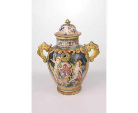 An Italian Majolica style wet drug Albarello 
Of tapered ovoid form, flanked by twin serpent handles, and single nozzled spou