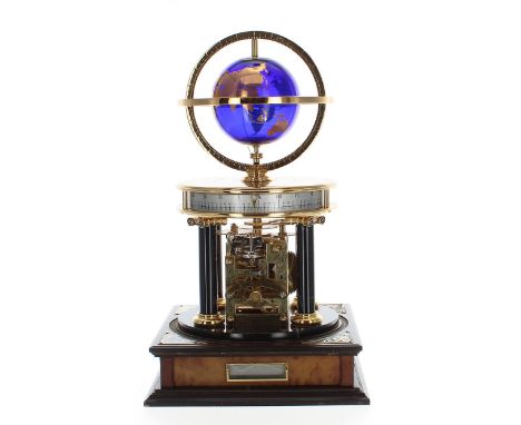 Royal Geographical Society Millennium electric clock, the top fitted with a cobalt blue and gilded globe over a horizontal si