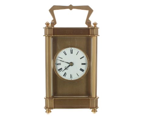 Carriage clock striking on a gong, the 1.75" white enamel dial within a gilt mask and angular pillared case, 6.25" high; also