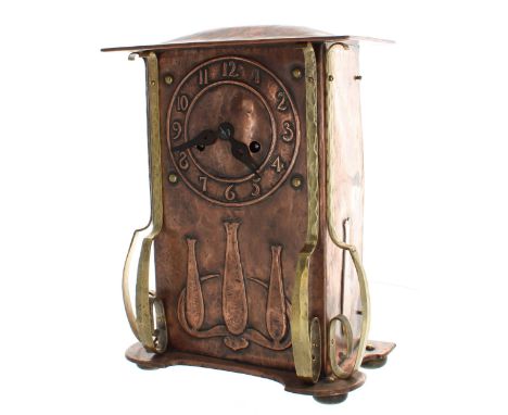 Art Nouveau oak, planished copper and brass clad two train mantel clock striking on a gong, the 5.5" chapter ring enclosing a