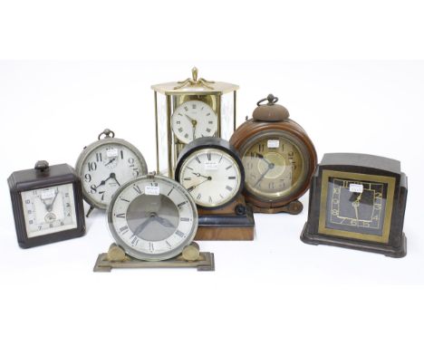 Kundo torsion clock within an hexagonal brushed brass case, 9.5" high; also six various small boudoir and mantel timepieces (