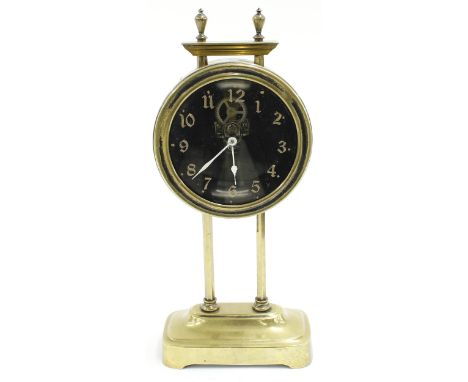 French brass gravity mantel&nbsp;clock&nbsp; timepiece, the 3.25" glass dial within a drumhead casing, upon ratchet supports 