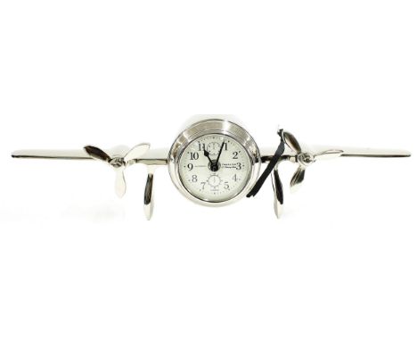 Novelty battery operated mantel clock timepiece in the form of aircraft wings with&nbsp;propellers, the 3" white dial with fa