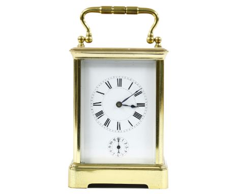 French carriage clock timepiece with alarm, within a corniche brass case, 7" high 