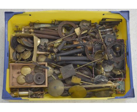 Large quantity of various clock fittings including mainly small mantel clock and other pendulums, brass corinthian columns an