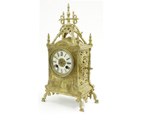 Small French brass two train mantel clock striking on a bell, the 3" cream dial within an ornate case, 13.75" high (pendulum)