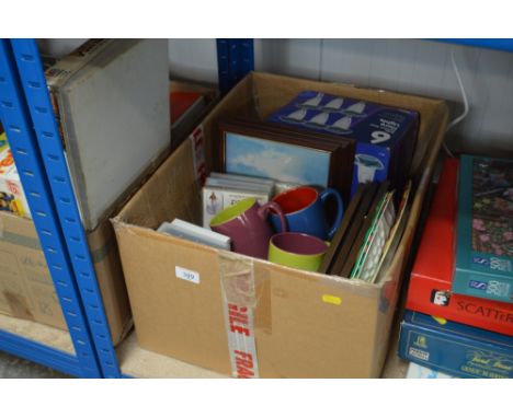 A box of various sundry items to include solar light; prints etc