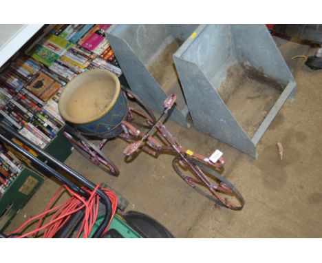 A metal planter in the form of a tircycle