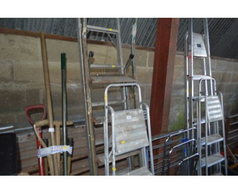 Two step ladders and one other