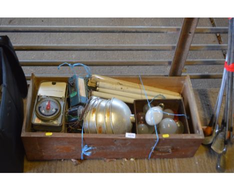 A drawer and contents of various light shades, bulbs, switches etc.