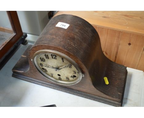 An oak cased three hole mantel clock
