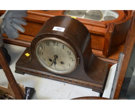 An oak cased two hole mantel clock 