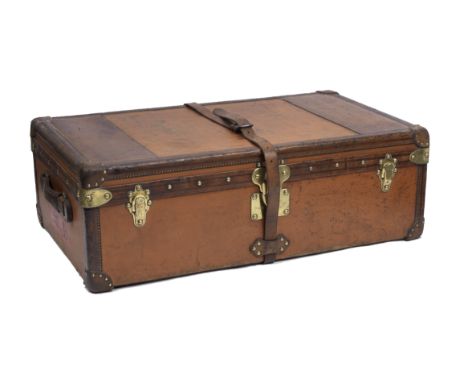 An early Louis Vuitton trunk, circa 1910,orange painted cloth covers with leather edging and patches, leather re-enforced riv