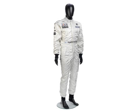 A signed set of used Mika Hakkinen 1997 McLaren Mercedes race overalls by SPARCO.signed to the right shoulder, white overalls