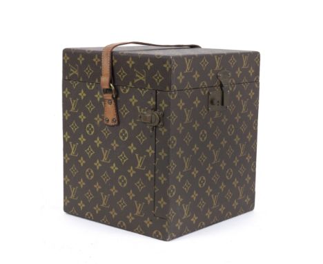 A Louis Vuitton wig trunk, circa 1960,LV patterned material, opening to revel beige lining with dummy head wrapped in cloth, 