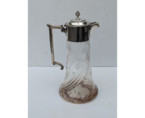 An Edwardian silver mounted glass claret jug, the lid with moulded finial and gadroon rim, angular handle and spiral reeded b