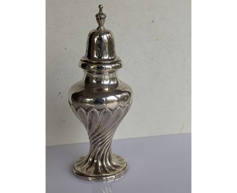 A late Victorian silver sugar caster of baluster form with urn finial and spiral twist design, initialled, 19.5 cm H, hallmar