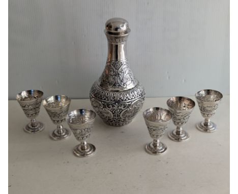 A mid-20th century Indian (probably Bombay) silver srew-top carafe, 23 cm H with six matching goblets, each 8 cm H, stamped T