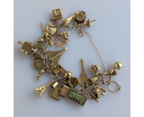 A 9ct yellow gold charm bracelet, 68.5g