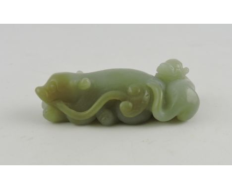 A jade paperweight, modelled in the form of two beasts intertwined, L. 7cm.
