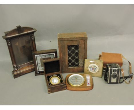 A Smiths oak cased mantle clock, H. 19cm, together with another, barometer, boxed compass with gimble, a key case, a clock ca