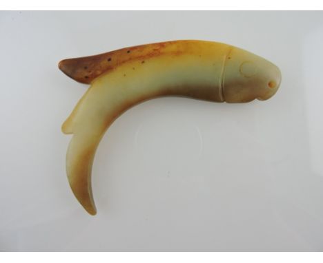 A jade pendant modelled in the form of a fish, H. 11cm