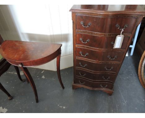 A reproduction mahogany serpentine front narrow chest fitted six drawers, together with a pair of reproduction mahogany demi 