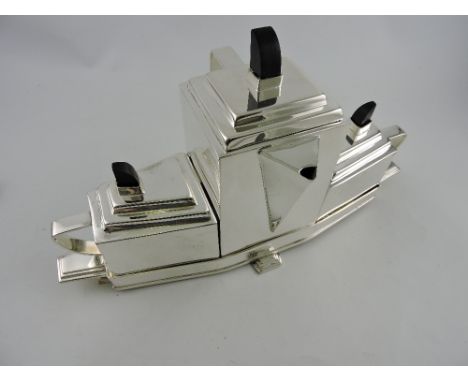 A silver plated Art Deco style three piece tea service on a fitted tray, fitted with ebonised knops, the tray with stepped pa