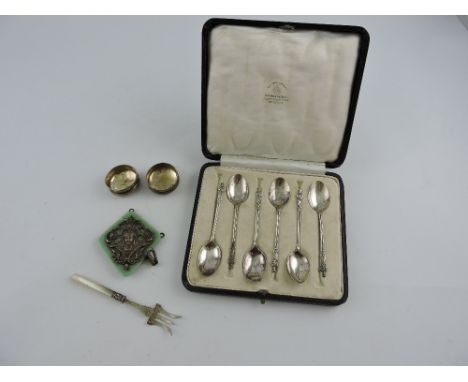 A boxed set of six silver apostle spoons, Birmingham 1919, Mappin & Webb, together with two silver bottle tops, white metal p