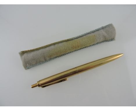 A Pelikan ball pen, with an engine turned yellow metal body stamped 14K, 19.9g. all in.