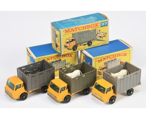 Matchbox Regular Wheels 37C Dodge Cattle Truck Group Of 3 - (1) Yellow cab and chassis, Muddy grey back, metal base and grill