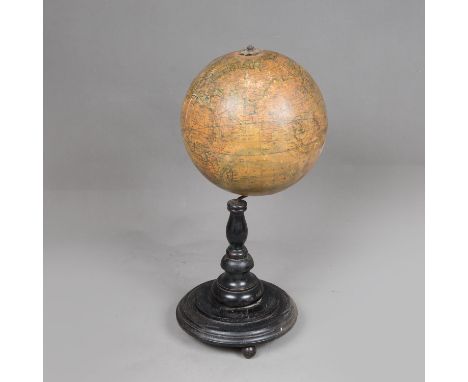 Table Globe, paper printed and described in German on original ebonized stand around 1900. 40 cm high.